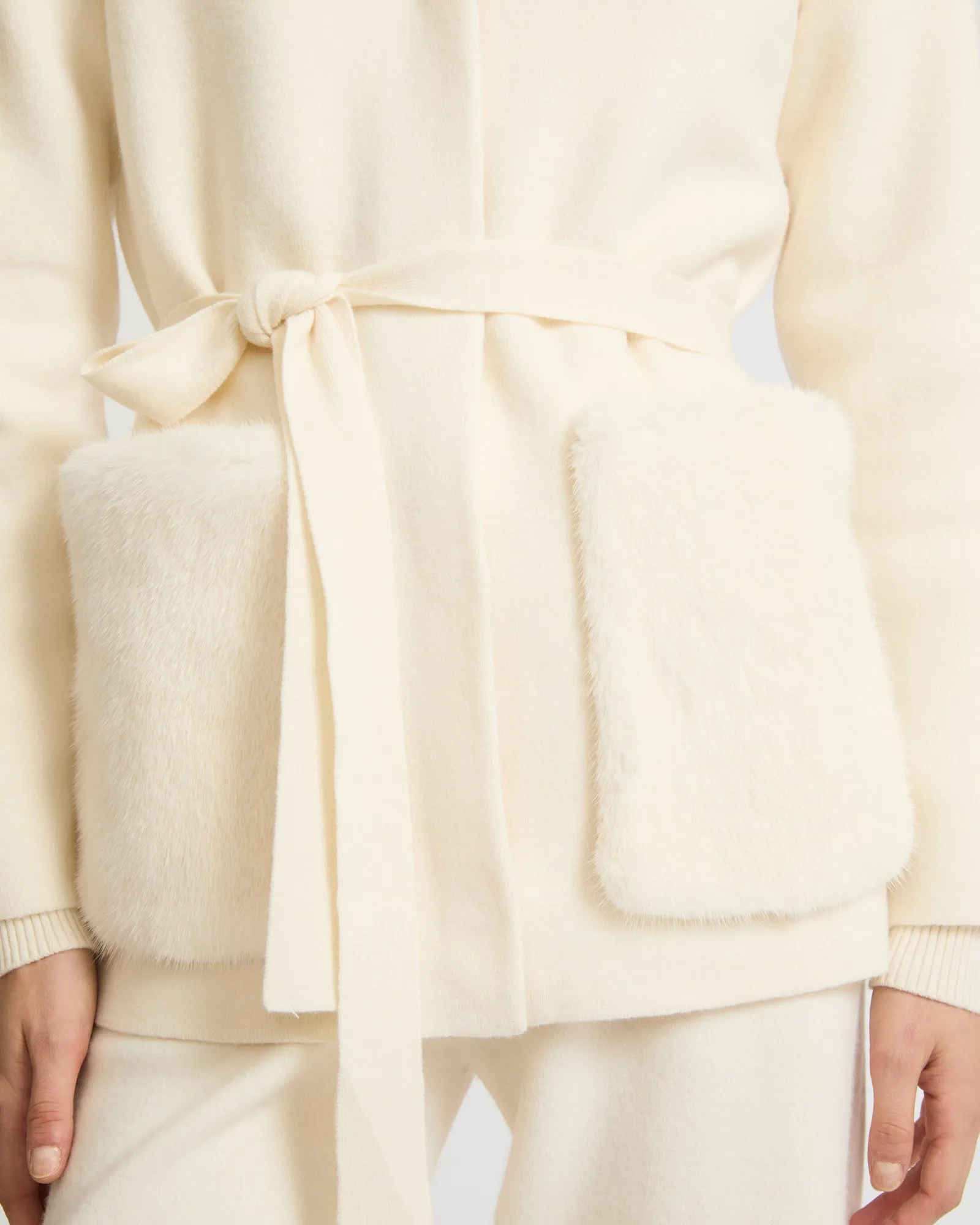 Belted knit and mink jacket